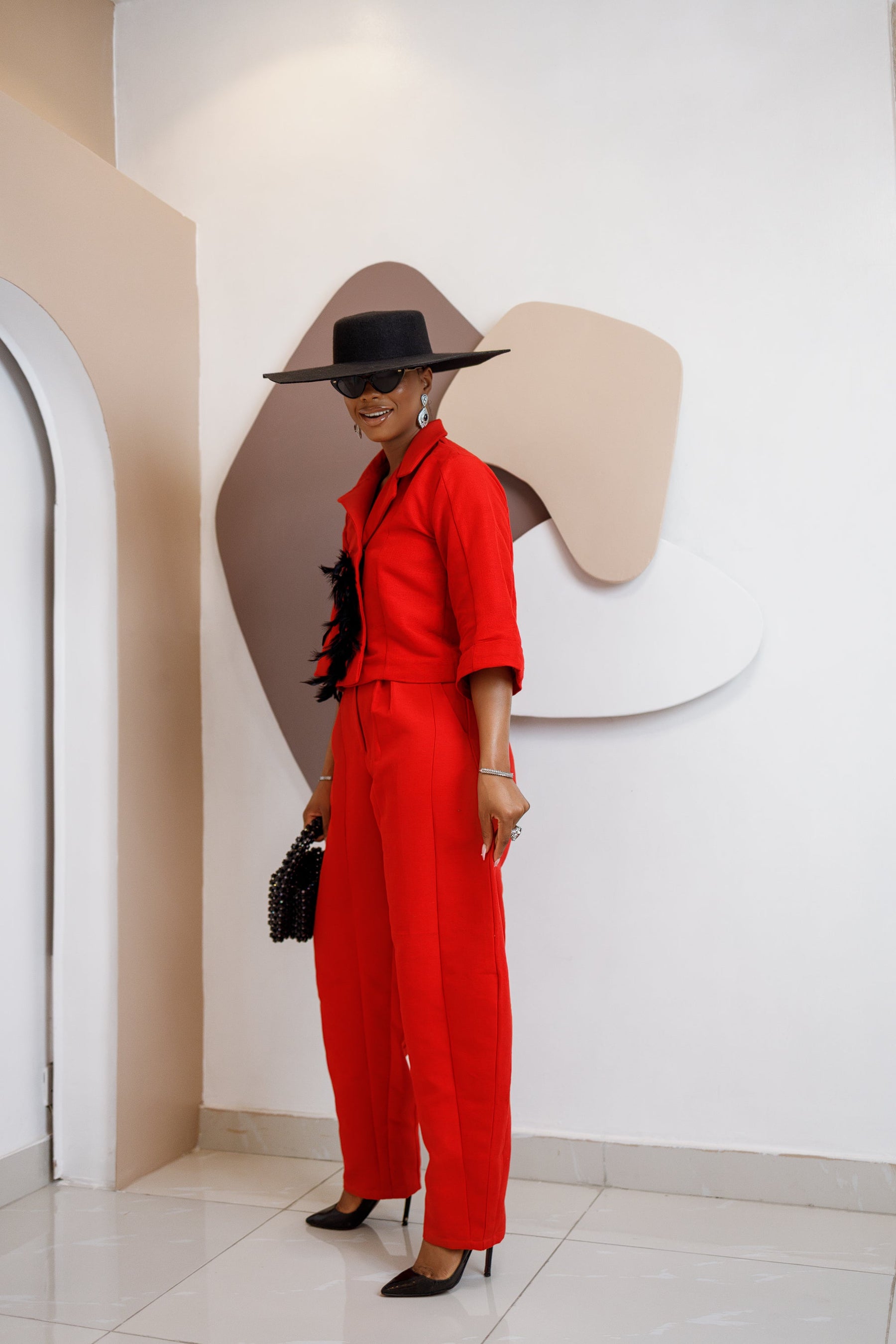 Nnekota Aso Oke Set – Red Two-Piece with Feathered Trimmings