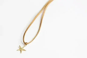 Large 14kt Gold Sea Star Charm on Faux Suede