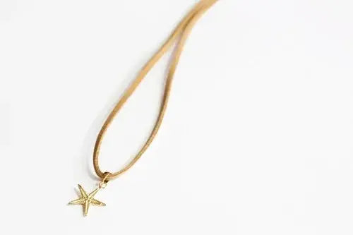 Large 14kt Gold Sea Star Charm on Faux Suede