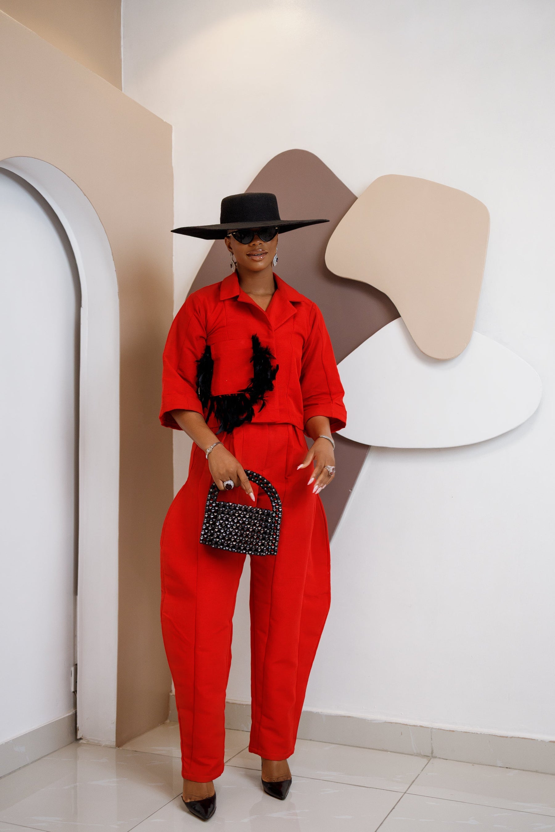 Nnekota Aso Oke Set – Red Two-Piece with Feathered Trimmings