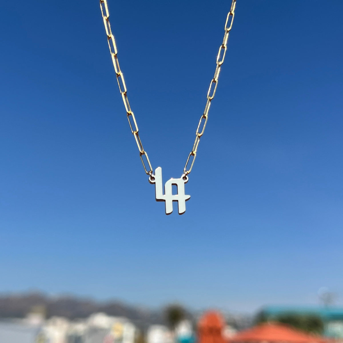 THE SIGNATURE “LA” NAMEPLATE NECKLACE
