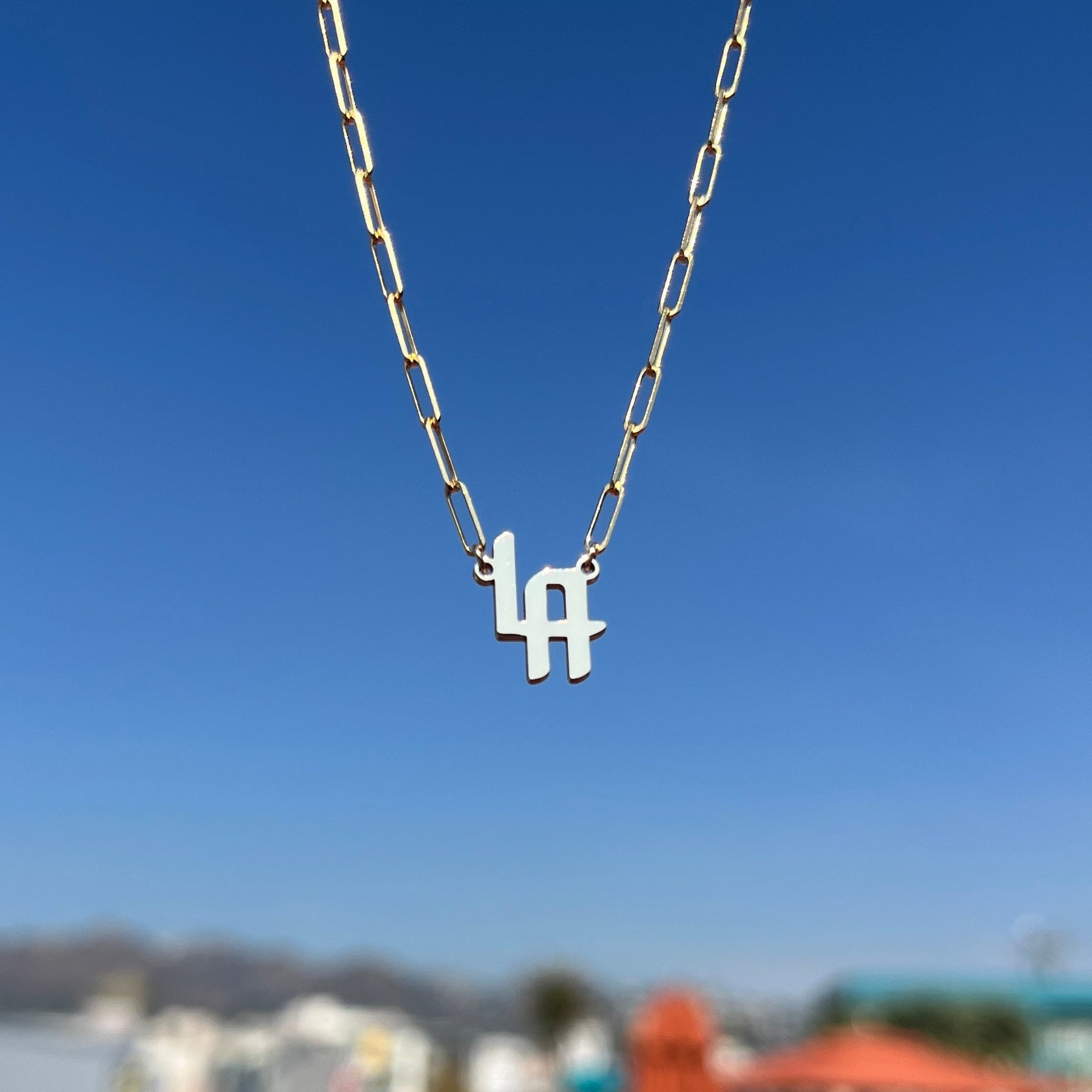 THE SIGNATURE “LA” NAMEPLATE NECKLACE