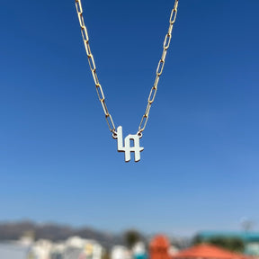 THE SIGNATURE “LA” NAMEPLATE NECKLACE