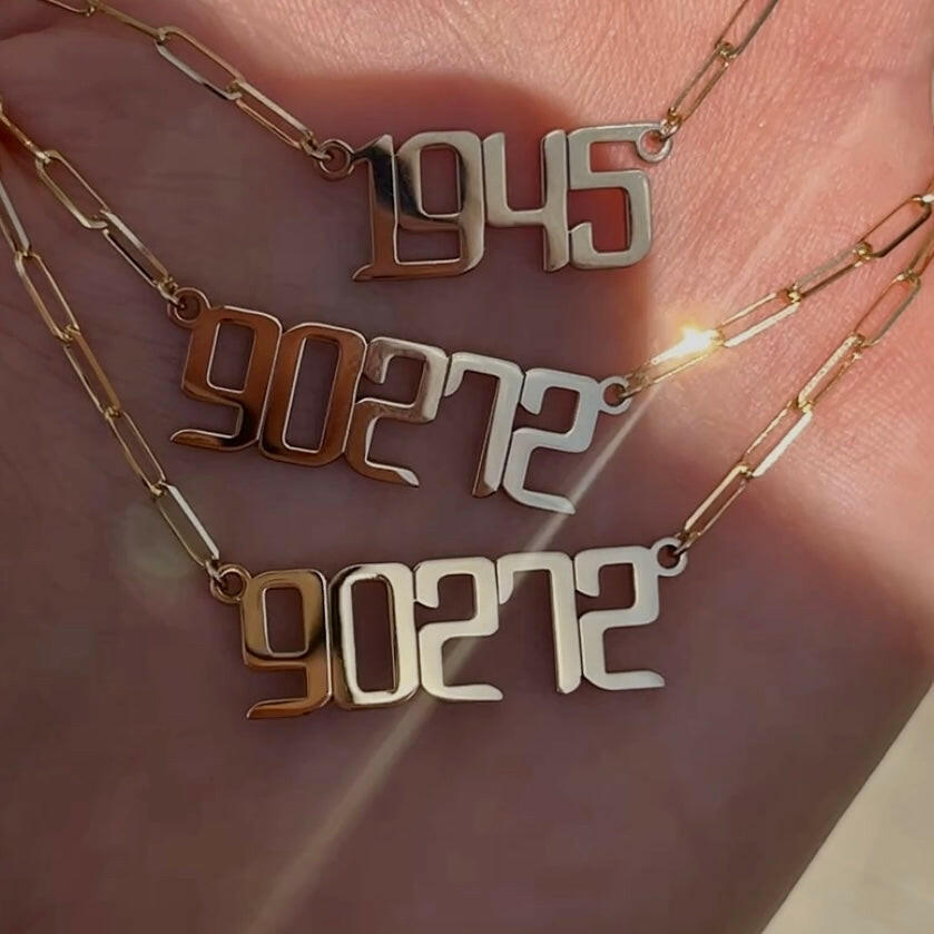 THE SIGNATURE “90272” NAMEPLATE NECKLACE