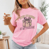 Stop Staring At My Package Funny Gift Graphic T-Shirt | Light Pink Holiday Humor Cotton Tee