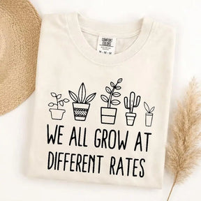 We All Grow At Different Rates Plant Graphic T-Shirt | Cute Ivory Botanical Cotton Tee