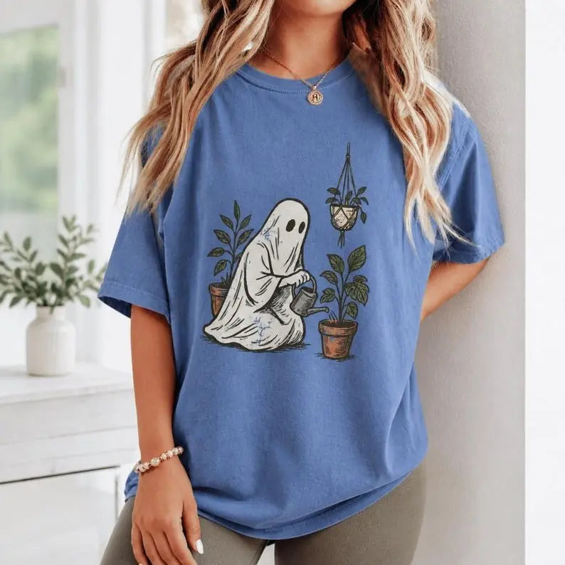 Gardening Ghost Watering Plants Halloween Graphic T-Shirt | Periwinkle Blue Spooky Plant Lover Cotton Tee