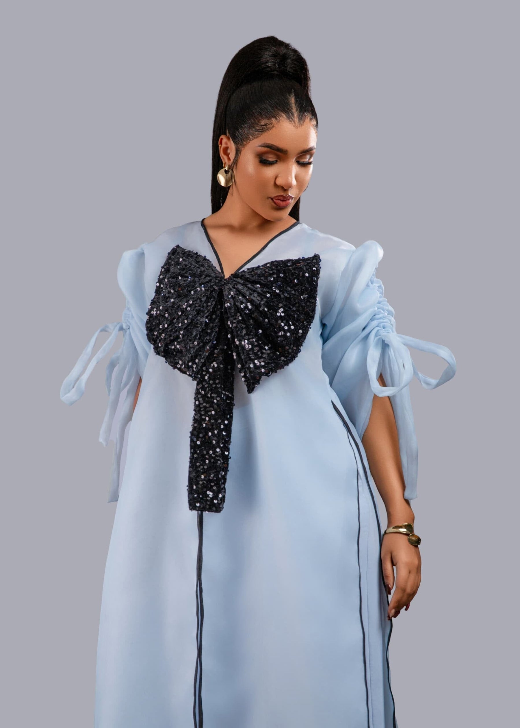 Blue kimono with black bow sequin and wide leg pant set.