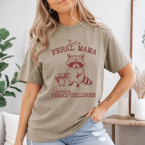 Just A Feral Mama Raising Feral Children Raccoon Graphic T-Shirt | Khaki Mom Life Cotton Tee