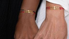 : /AH-MI/ Friendship & Travel Bracelet Sterling Silver Red Cord