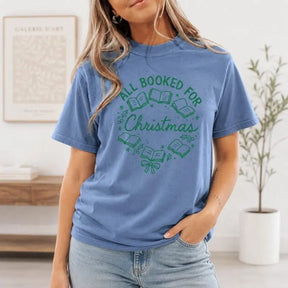 All Booked For Christmas Wreath Graphic T-Shirt | Cornflower Blue Holiday Bookworm Cotton Tee