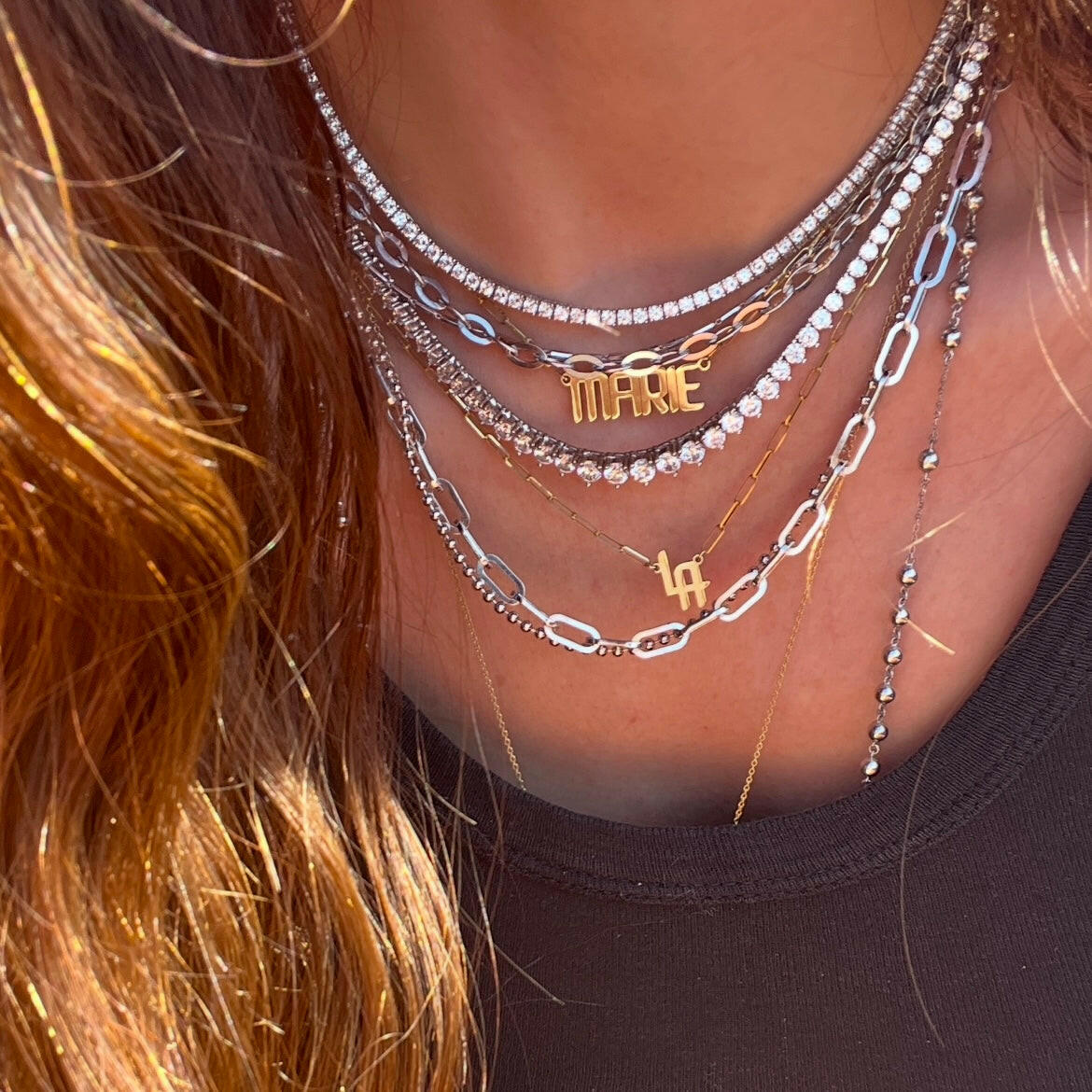 THE SIGNATURE “LA” NAMEPLATE NECKLACE