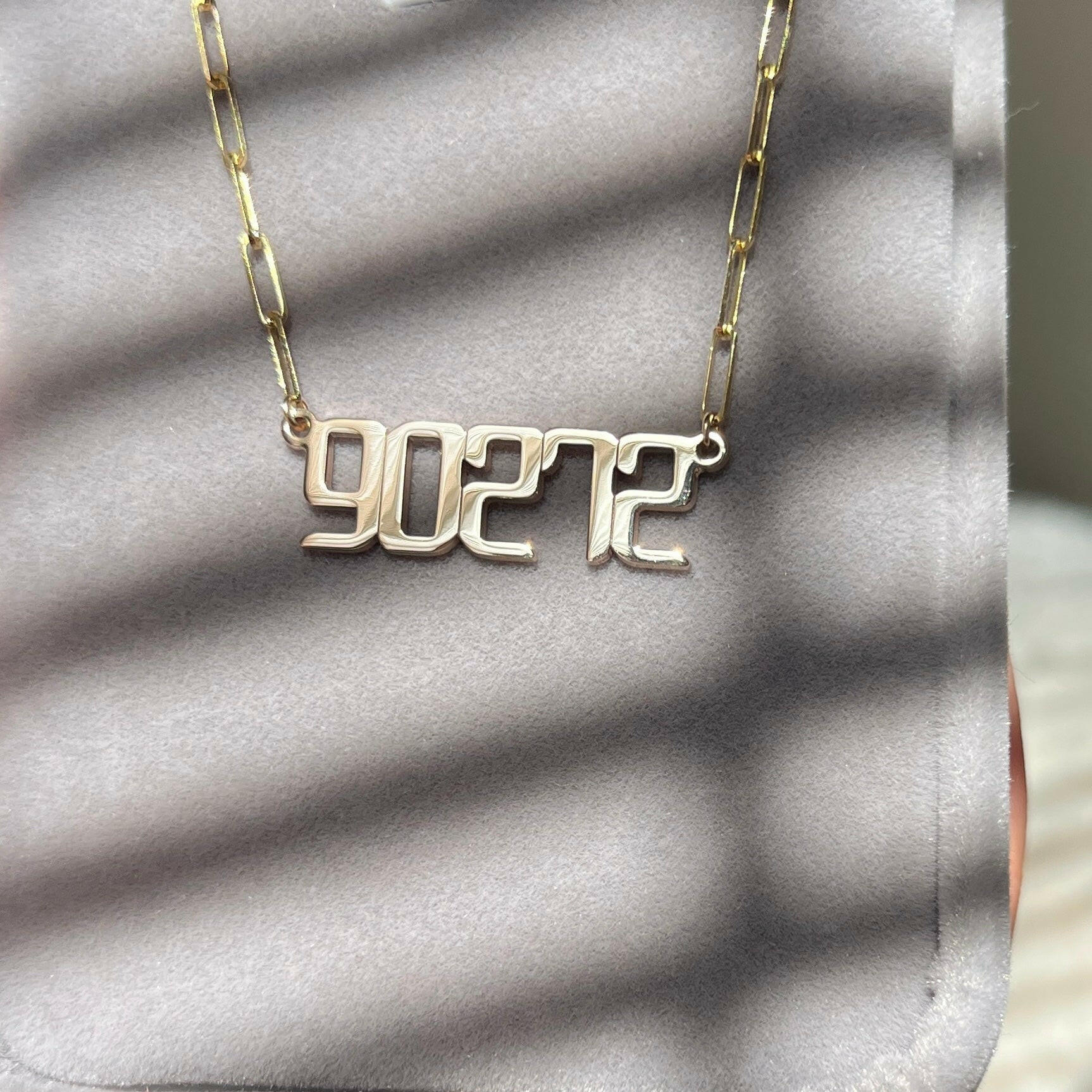 THE SIGNATURE “90272” NAMEPLATE NECKLACE