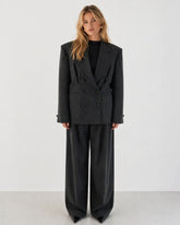 Double-breasted fitted blazer with subtle peplum silhouette