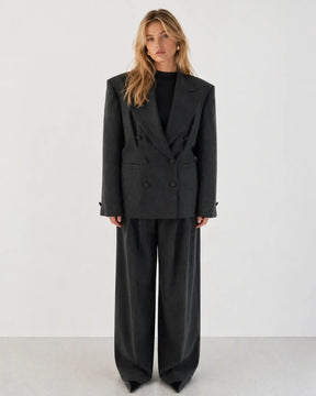 Double-breasted fitted blazer with subtle peplum silhouette