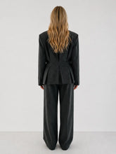 Double-breasted fitted blazer with subtle peplum silhouette