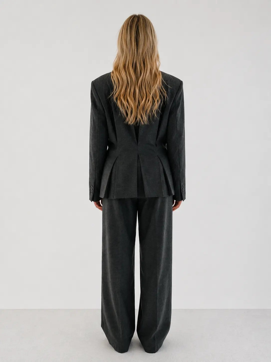 Double-breasted fitted blazer with subtle peplum silhouette