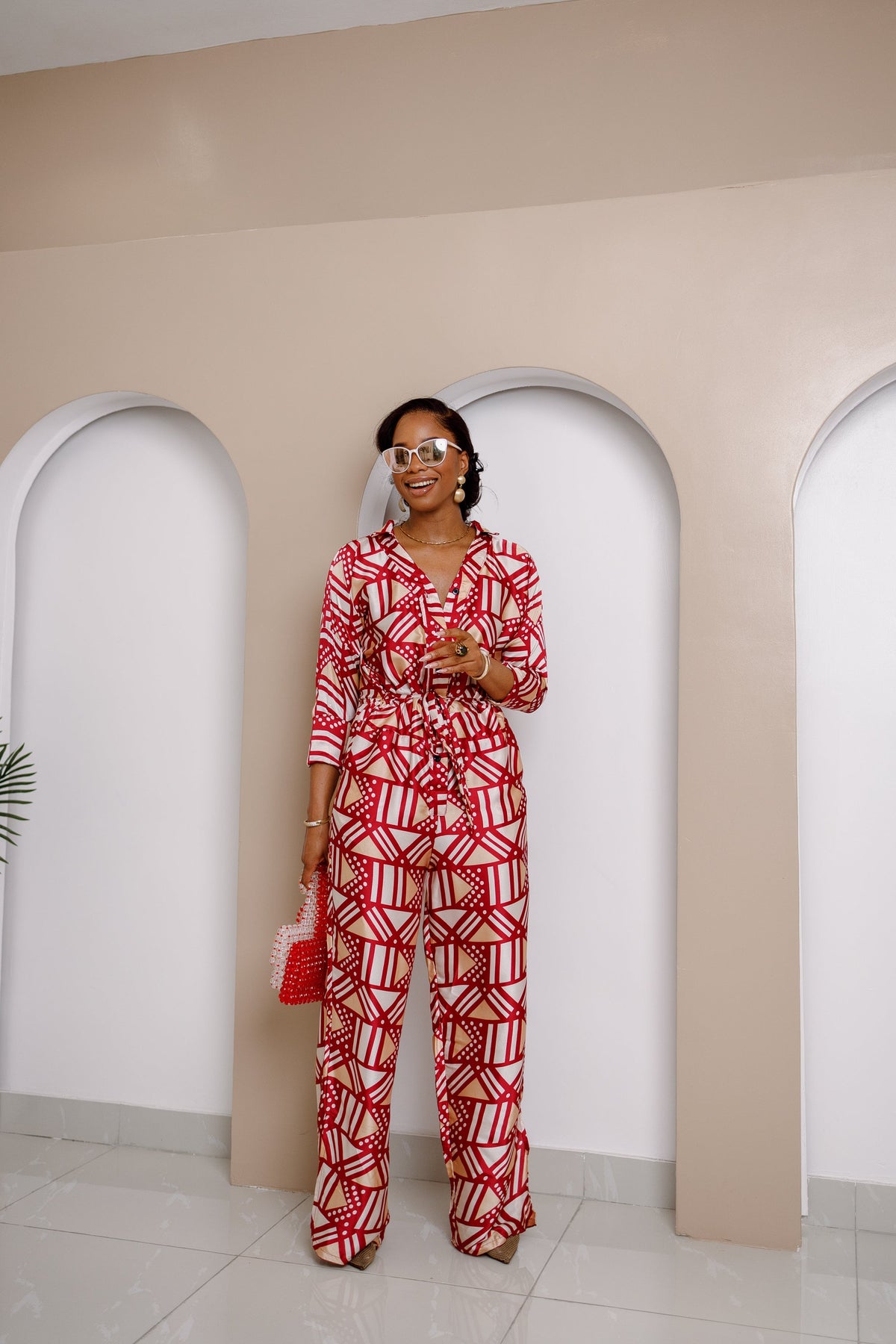 Onwenwem Silk Jumpsuit – Bold Red & White Geometric Print