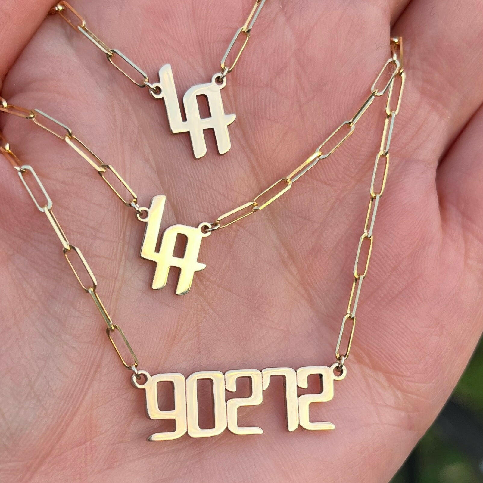 THE SIGNATURE “LA” NAMEPLATE NECKLACE