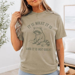 It Is What It Is And It Is Not Great Raccoon Graphic T-Shirt | Khaki Olive Sarcastic Humor Cotton Tee