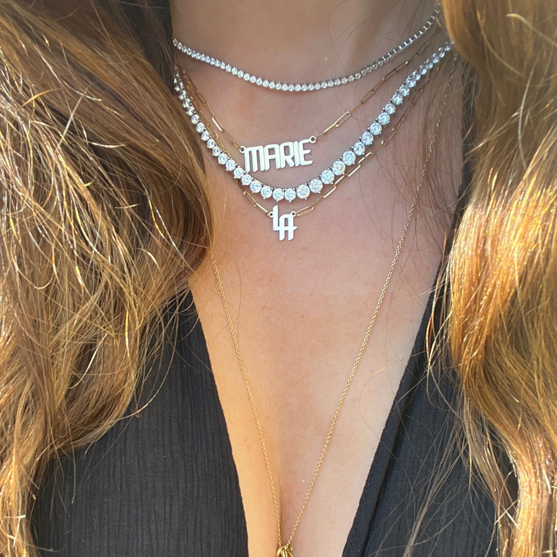THE SIGNATURE “LA” NAMEPLATE NECKLACE