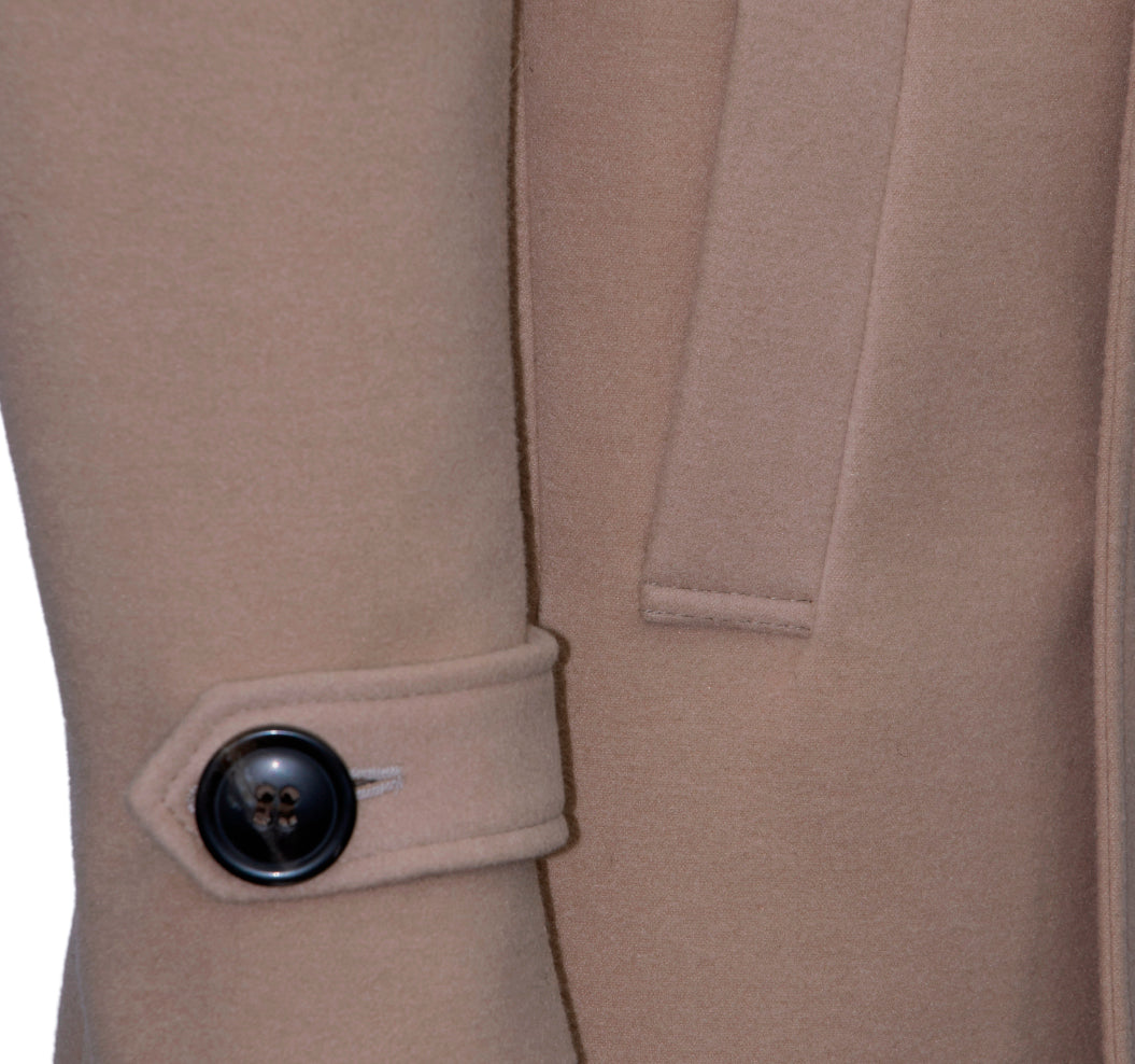 Beige double-breasted coat with wide lapels.