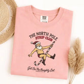 The North Pole Strip Club Santa Graphic T-Shirt | Funny Adult Christmas Light Pink Cotton Tee