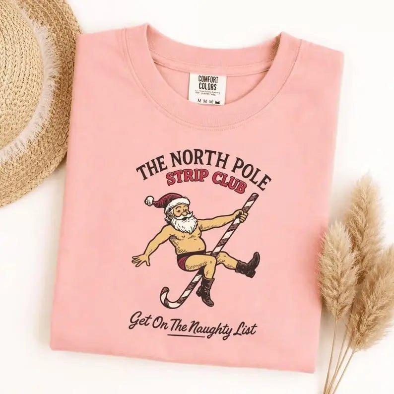 The North Pole Strip Club Santa Graphic T-Shirt | Funny Adult Christmas Light Pink Cotton Tee