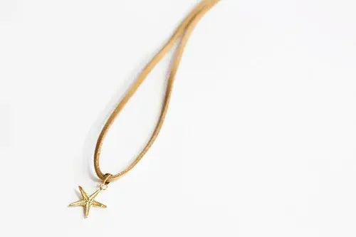 Small 14kt Gold Sea Star Charm on Faux Suede